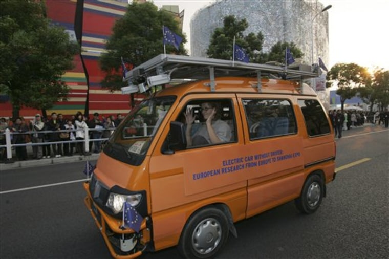 One of two driverless vehicles, equipped with laser scanners and cameras to detect and help avoid obstacles, travels on the Shanghai Expo site to attend the official celebration of their arrival in Shanghai.